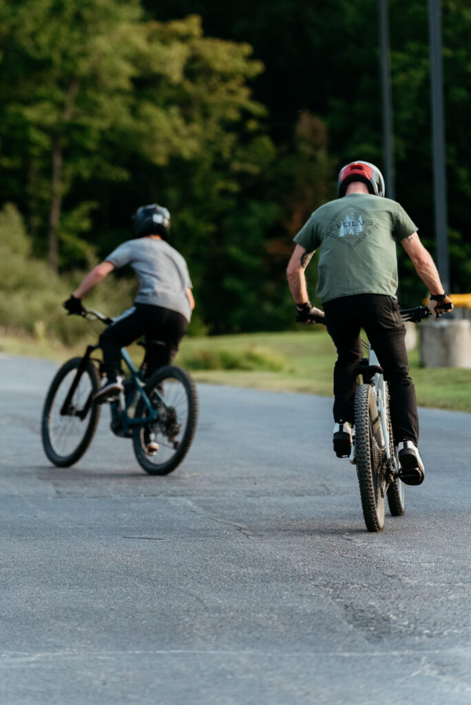 Riders testing Transition bikes on pavement