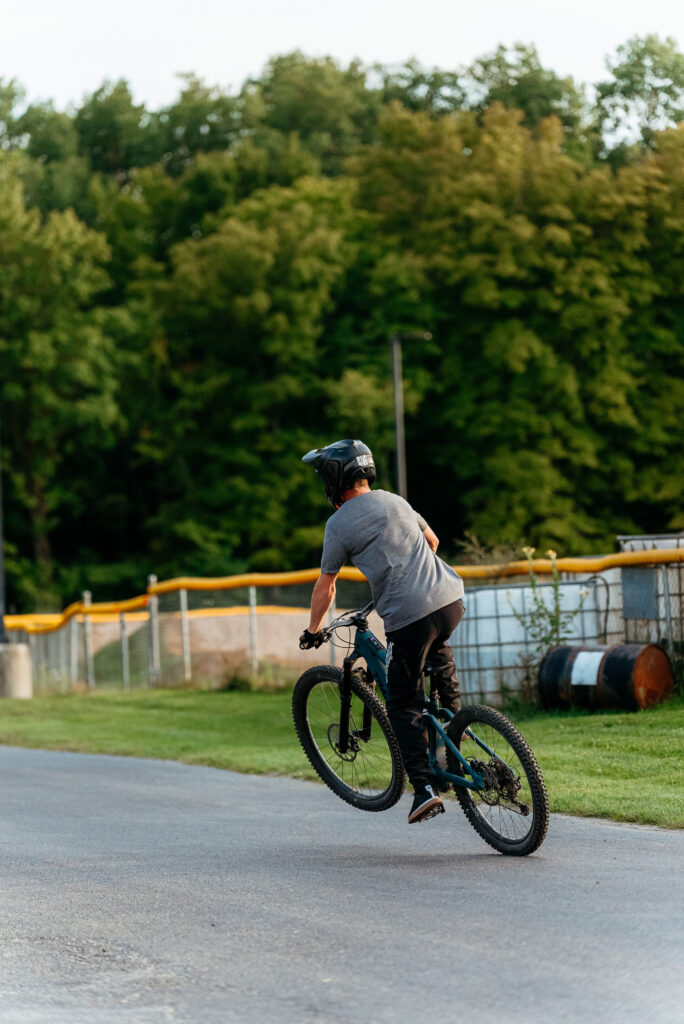 Rider testing a Transition MTB with a jump at Biked's demo day in Rockford MI