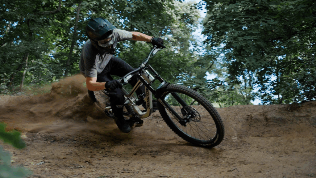 Mountain bike rider on Grand Rapids trails hitting suspension jumps